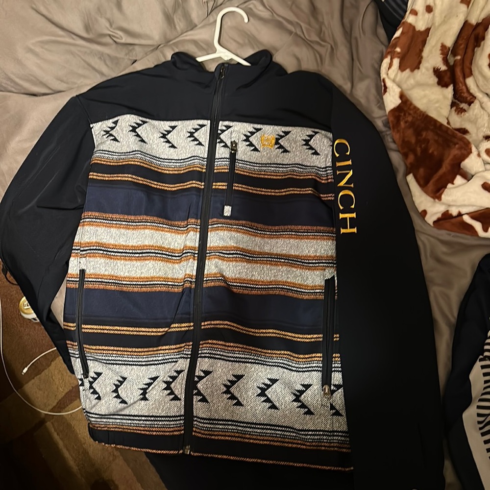 Cinch full-zip weather blocking coat.